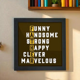 Father's Day gift frame with bold typography spelling FATHER using words like Funny, Handsome, Strong in a black wood poster frame.